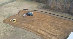An aerial view of a construction site with an earthwork and excavation contractor performing site development.